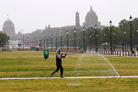 A worker at Kartavya Path lawns